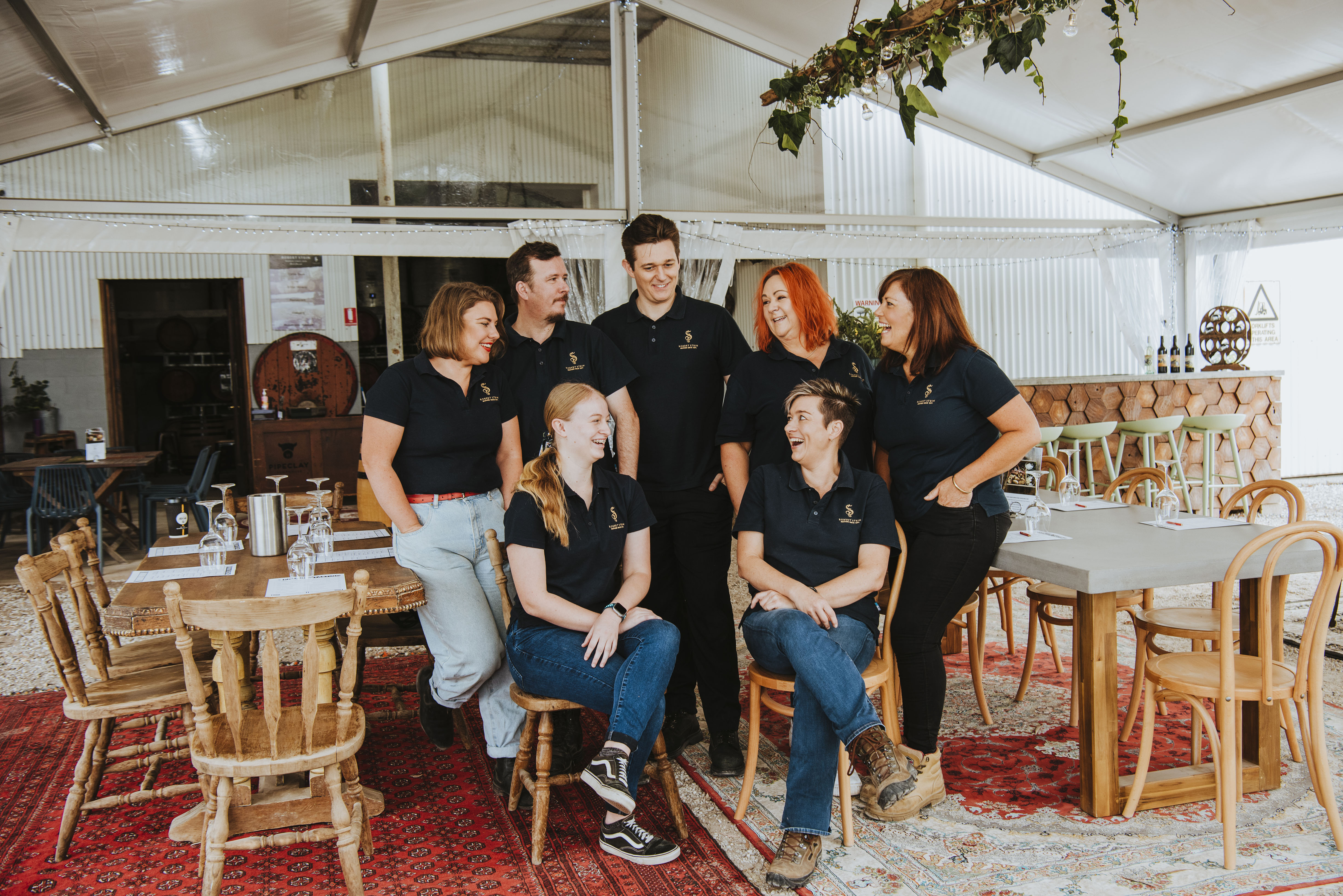 Restaurant staff posing in dining area